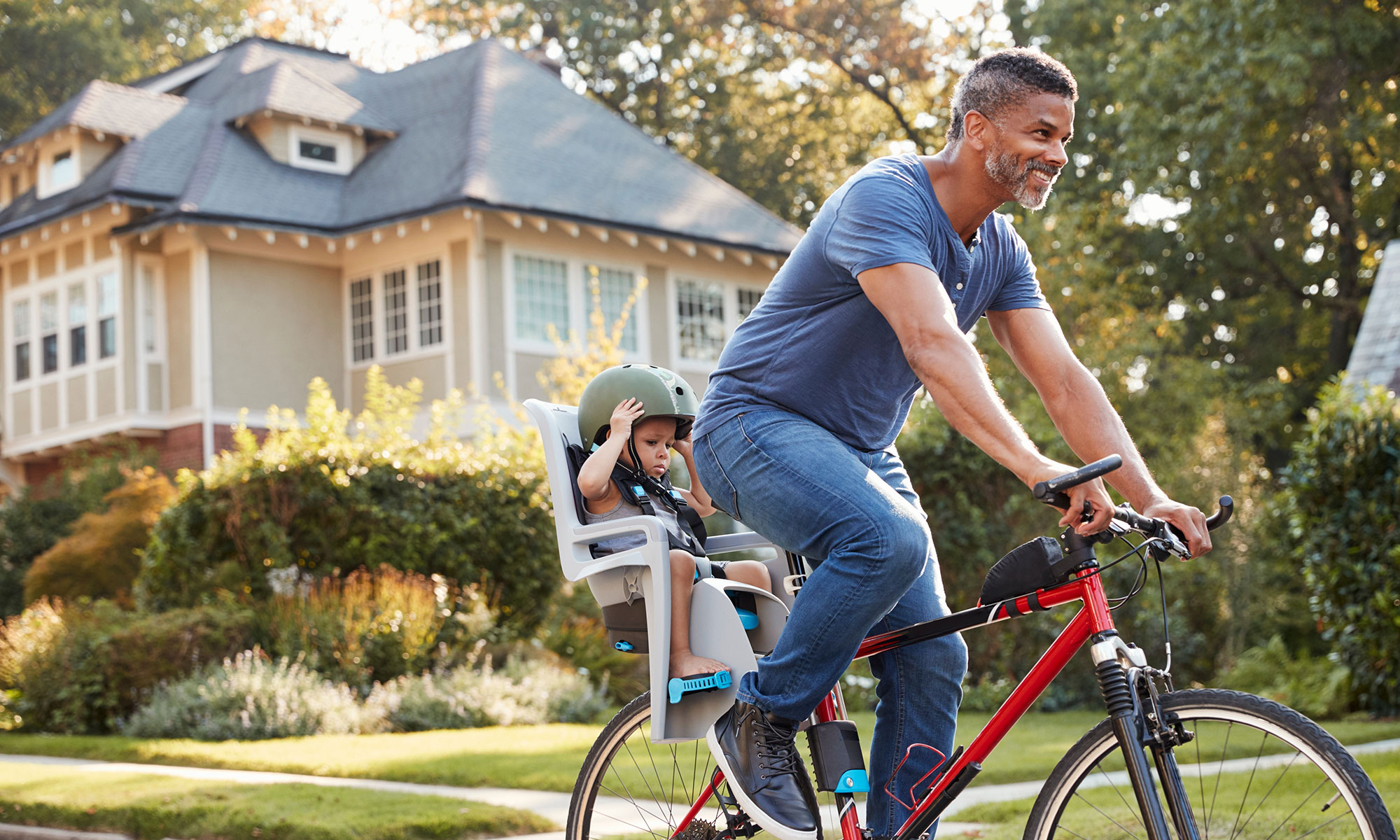 Man With Child On Bicycle - GPO Housing Strategy Header Image