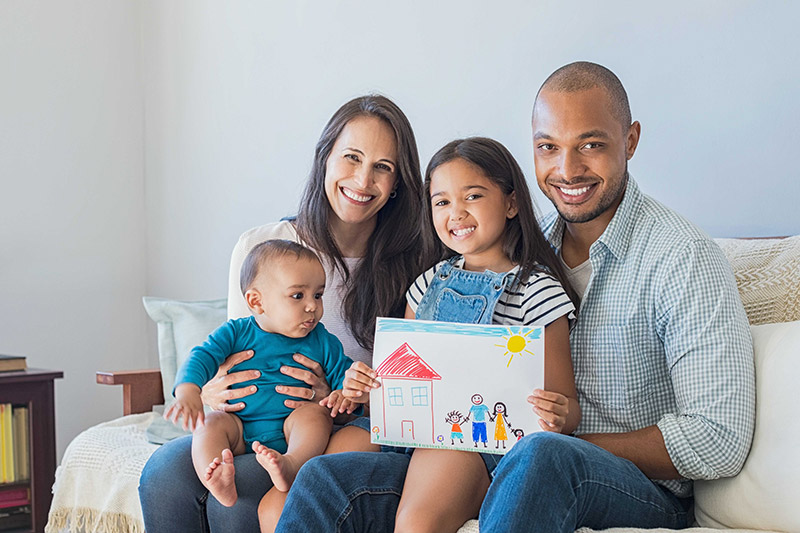 Happy Family With Child's Drawing - GPO Housing Strategy