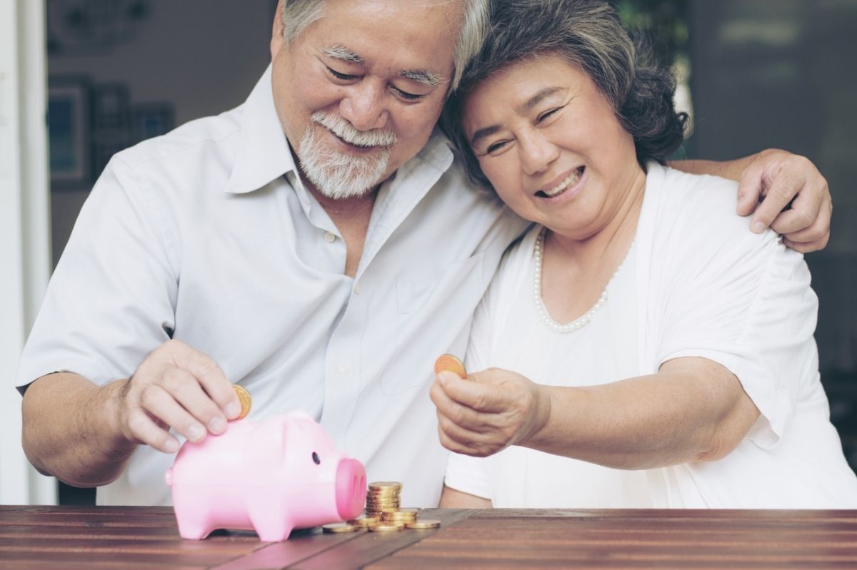 Senior Couple With Piggy Bank - GPO Housing Strategy