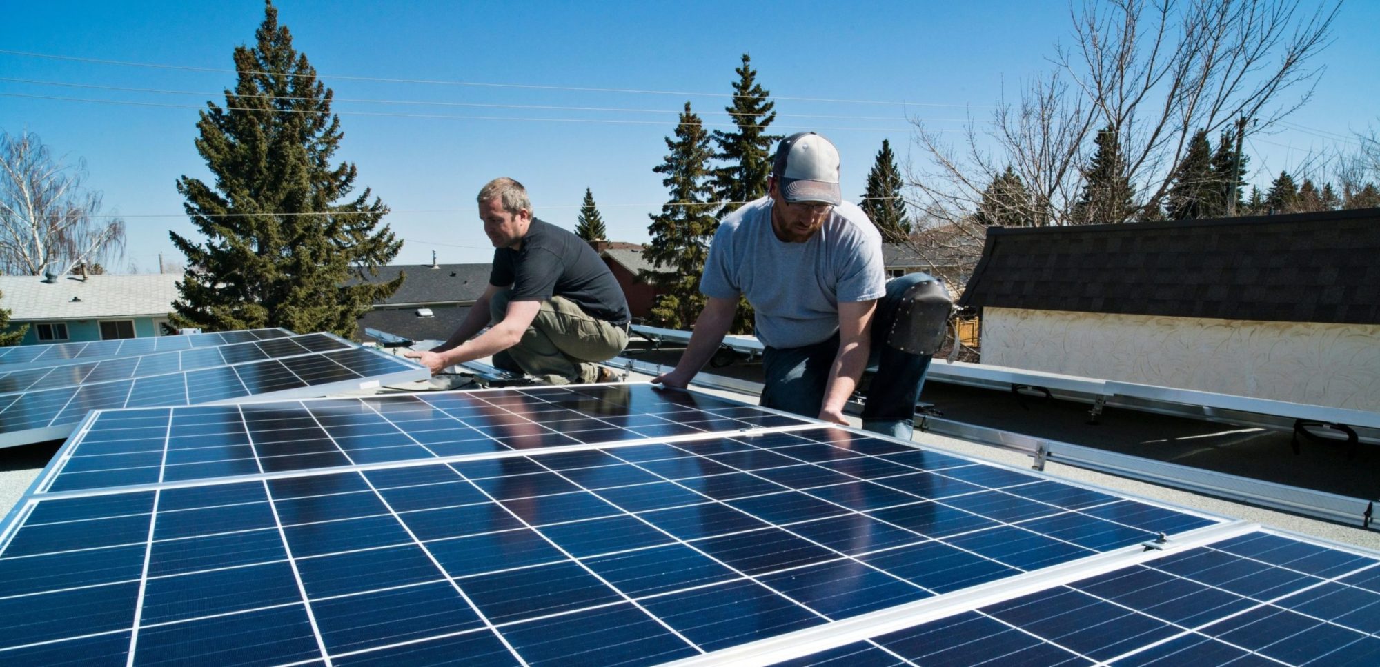 Workers installing solar panels